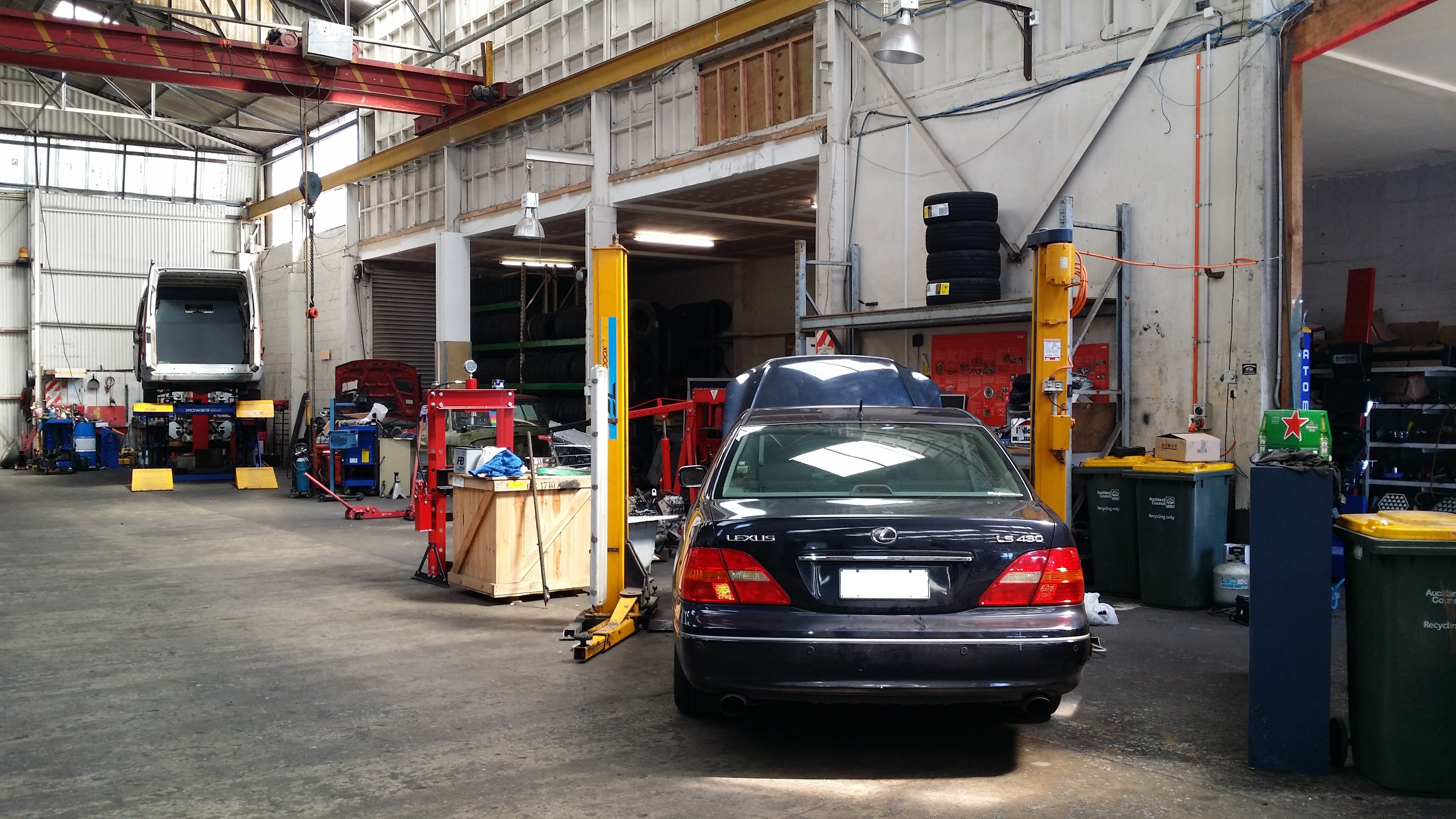 Black Lexus car being serviced in Takanini Auto Service Centre workshop.