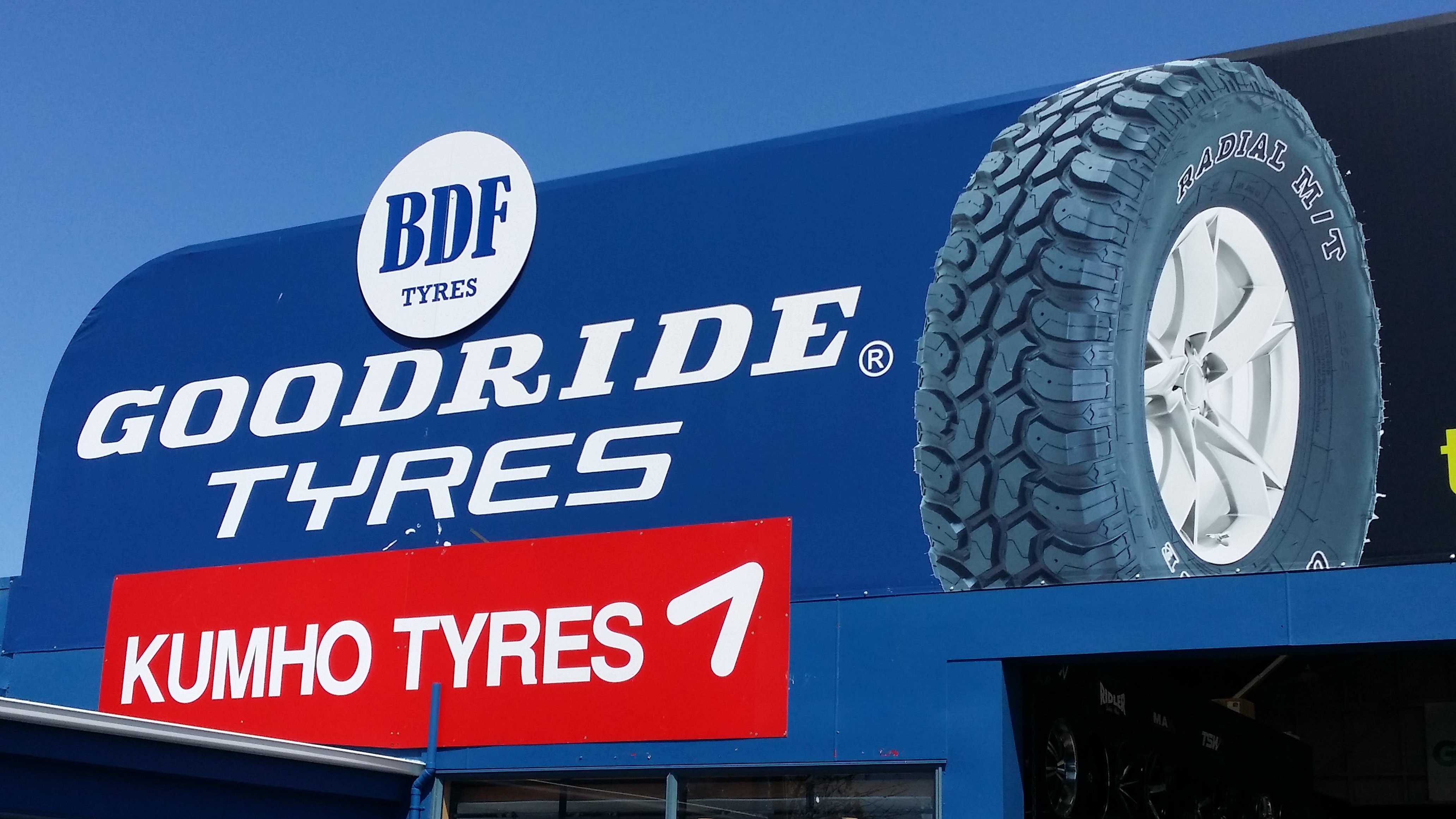 BDF Tyres, Goodride Tyres and Humho Tyres signs on the roof of Takanini tyre centre